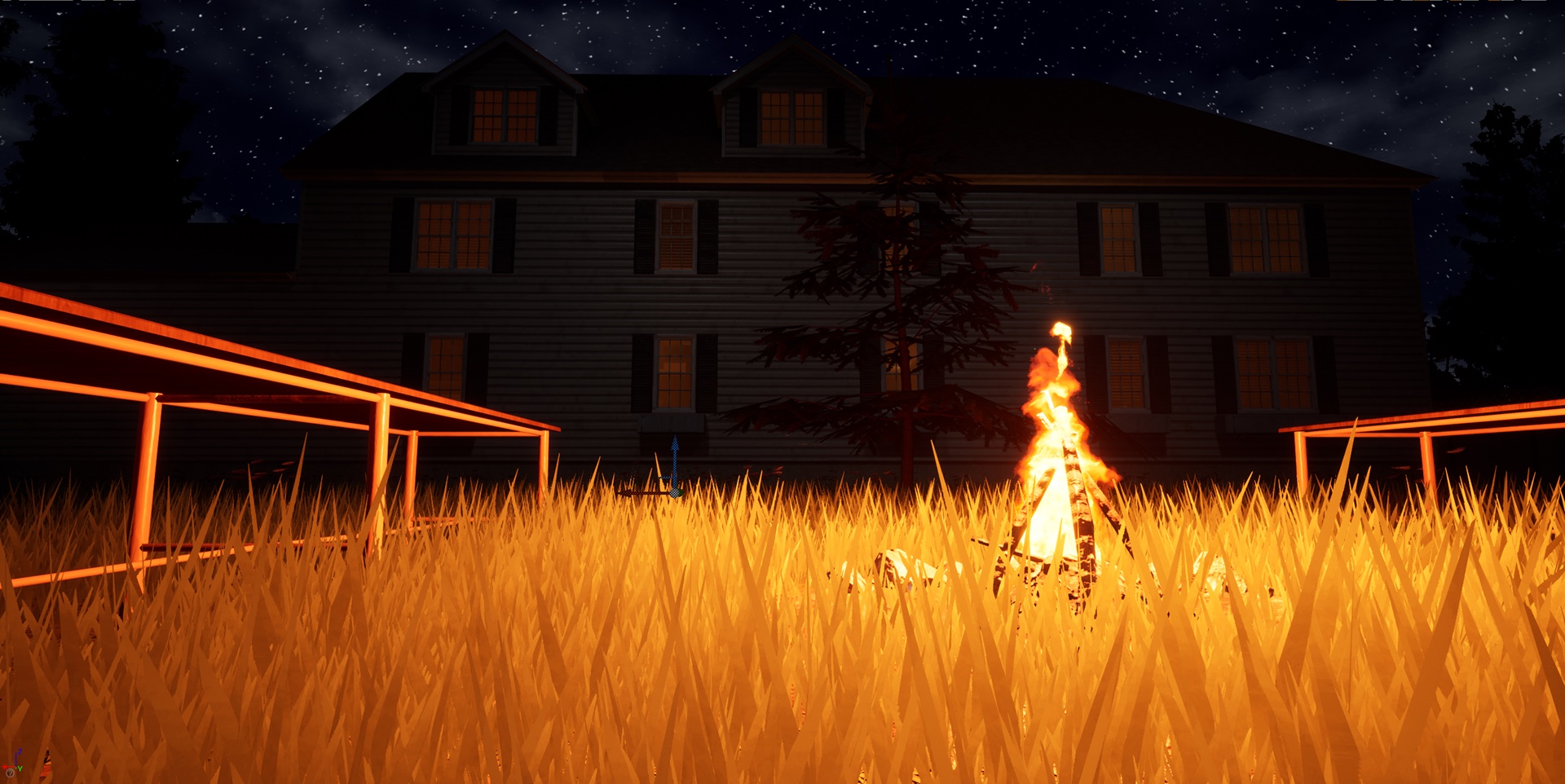 A bonfire burning in a field of tall grass in front of the house at night, behind a lit wooden fence.