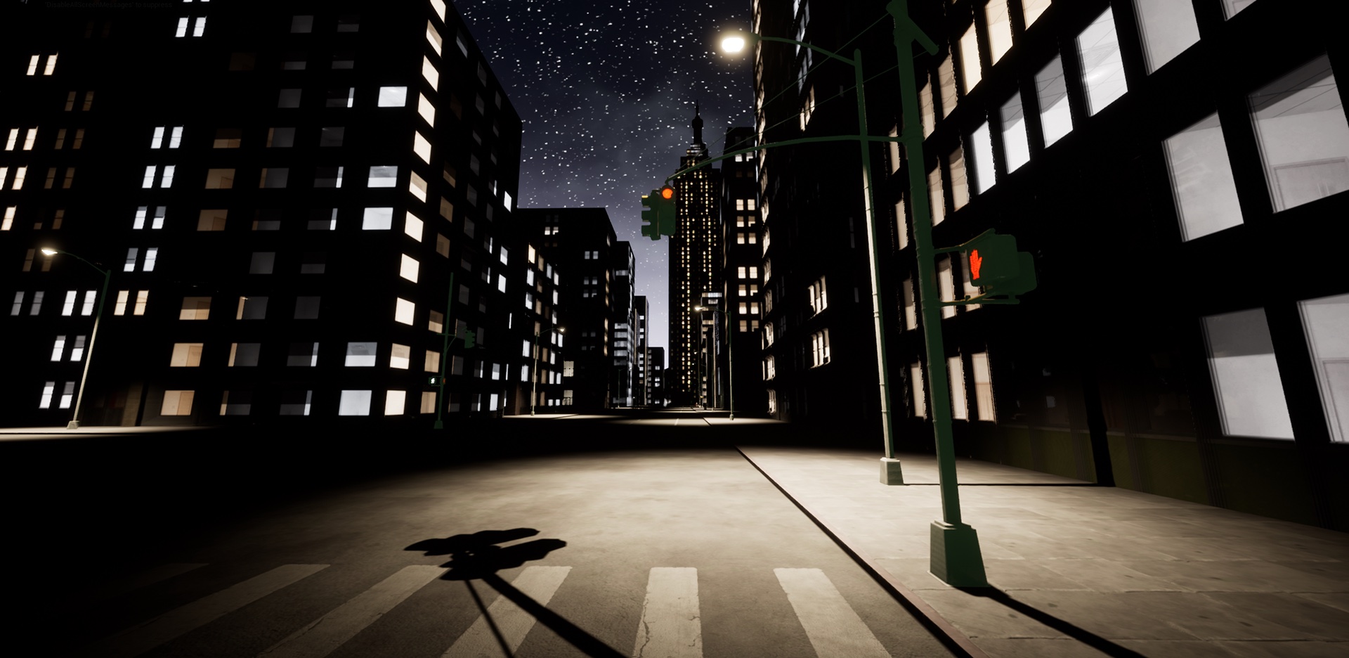 A street corner at night under a traffic signal, with a crosswalk in the foreground.